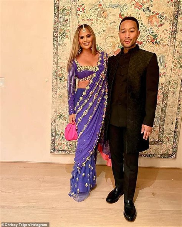 Chrissy Teigen Stuns In Purple Sari As She & Husband John Legend Celebrate Diwali