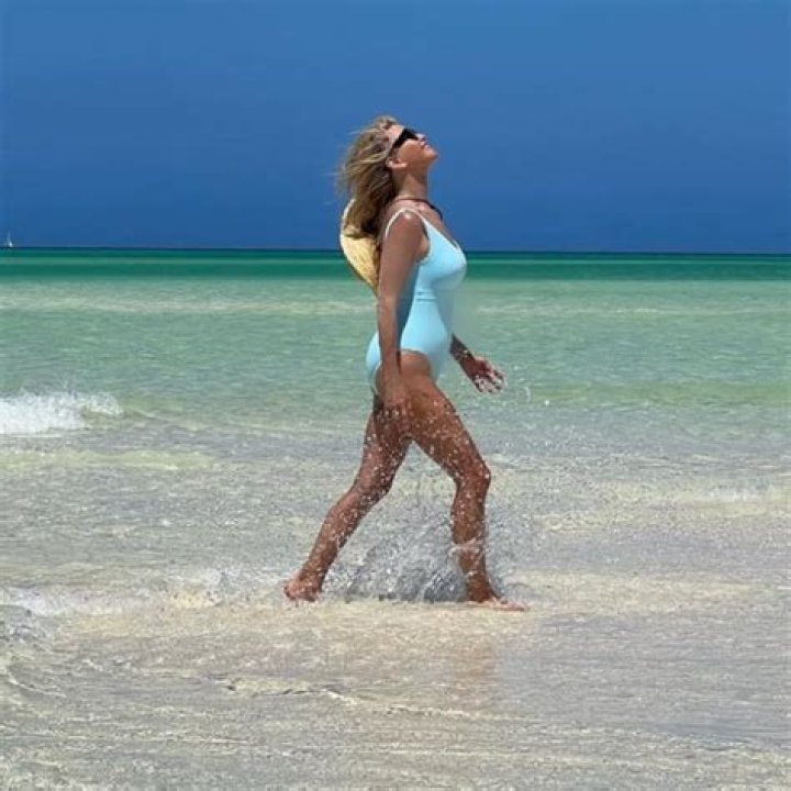 Christie Brinkley, 68, Poses In Sexy Plunging Swimsuit By The Pool For Photo Shoot