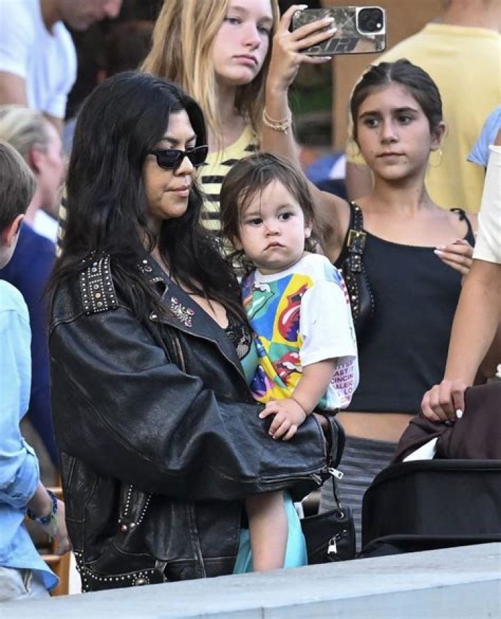 Kourtney Kardashian & Daughter Penelope, 9, Link Arms As They’re All Smiles On Night Out With Travis Barker