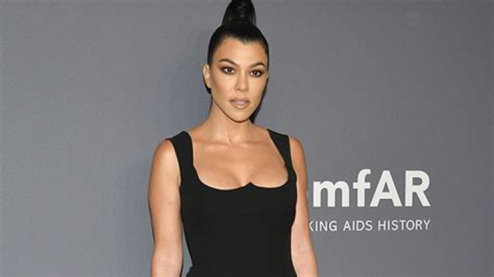 Kourtney Kardashian Imitates Miley Cyrus’ VMAs Performance By Swinging On A Disco Ball In LBD — Pic